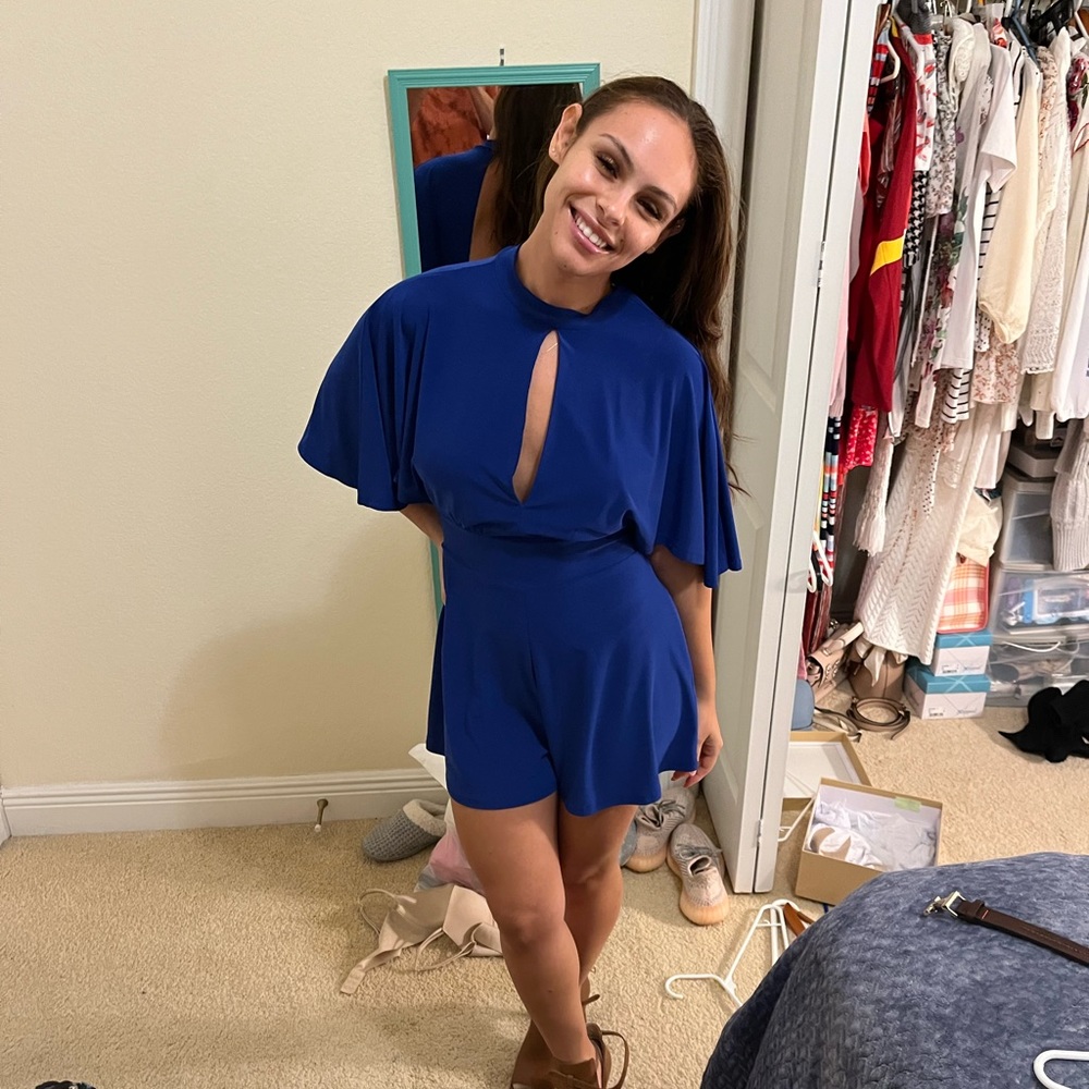 Blue romper, only worn once. It’s got a cut out in the middle and open back!